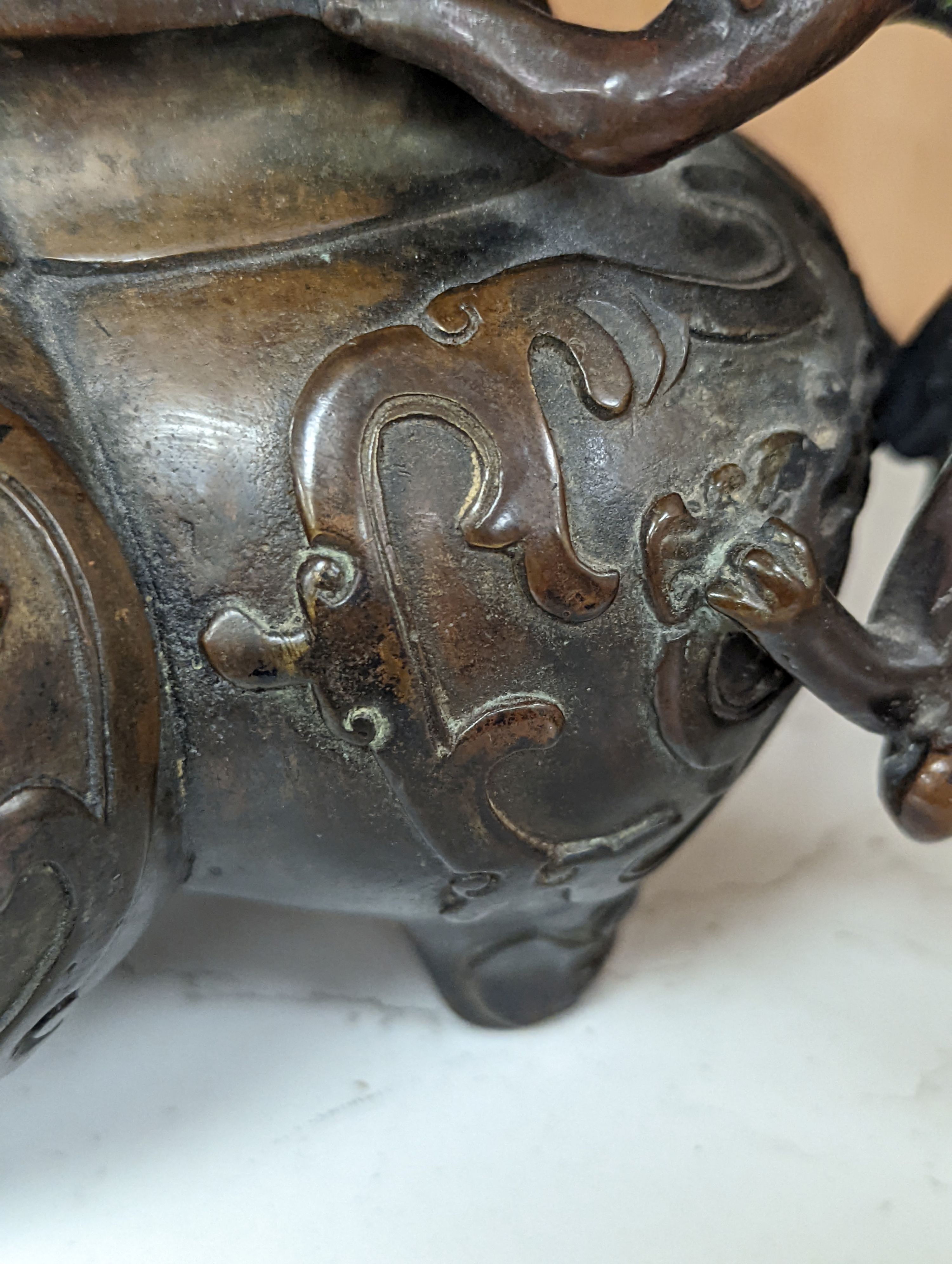 A 19th century Chinese bronze quatrefoil censer, with four character mark - 19cm high